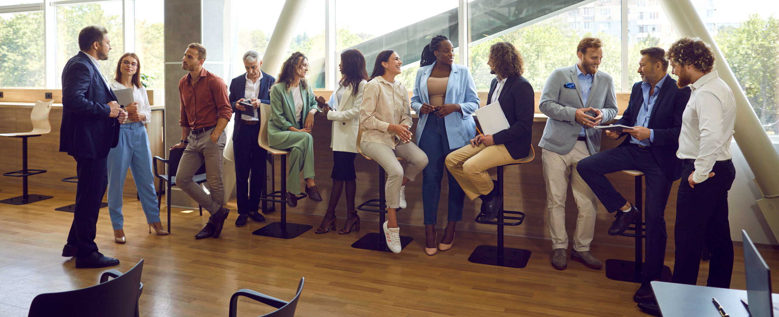 Diverse professionals connecting at a workplace gathering